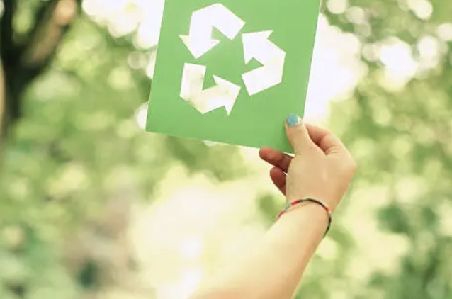 A recycle going green initiative in a hand